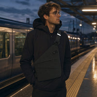 Sling worn on a train platform at dusk thumbnail
